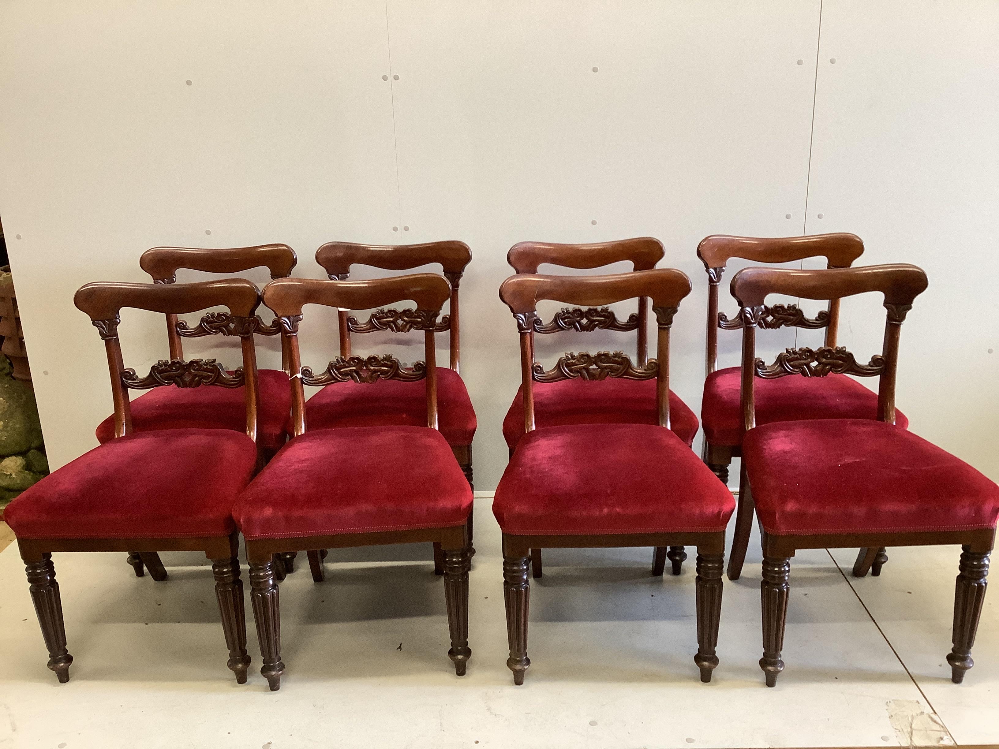 A set of eight early Victorian mahogany dining chairs, on turned fluted legs